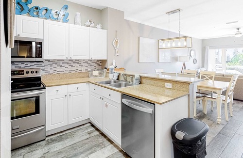 Frangista Beach Condo | Updated ground floor beachside condo with private beach access & patio