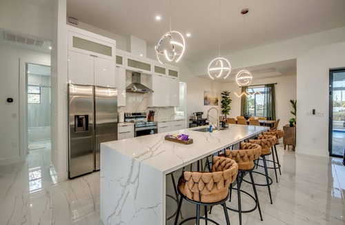 Pelican Villa | Villa Coral Bliss - Awesome 4 BR/3 bath waterfront villa w. heated pool, hot tub, kayaks, fishing poles, bikes