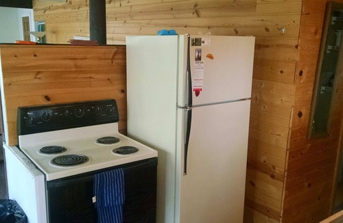 Mears Cottage | Waterfront Cabin on Silver Lake Channel. Row or Motor boat to the Sand Dunes.