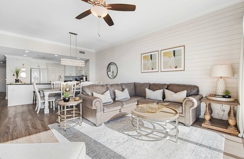 Thomas Drive Condo | Waterfront condo with pool & hot tub access, Gulf views, W/D, & central AC