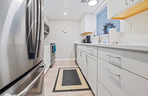 Dunedin Condo | Waterfront Condo w/Heated Pool, Pier & Sunset Views – Walk to Dunedin Causeway & Honeymoon Island!