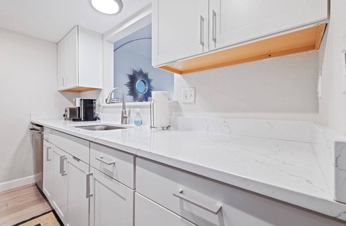Dunedin Condo | Waterfront Condo w/Heated Pool, Pier & Sunset Views – Walk to Dunedin Causeway & Honeymoon Island!