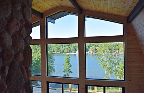 Scottville House | Waterfront Nordic Lodge on All Sports Lake, come with the whole family.
