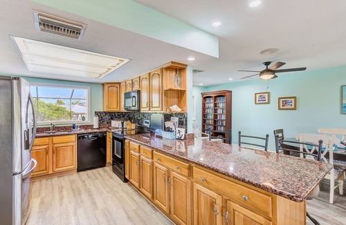 Apollo Beach House | Waterfront Oasis w/screened Lanai & Pool, Private Dock + Kayaks 3BR/2BA