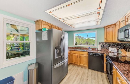 Apollo Beach House | Waterfront Oasis w/screened Lanai & Pool, Private Dock + Kayaks 3BR/2BA