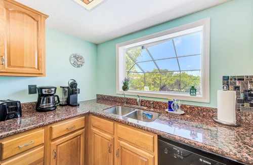 Apollo Beach House | Waterfront Oasis w/screened Lanai & Pool, Private Dock + Kayaks 3BR/2BA