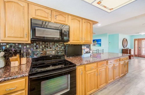 Apollo Beach House | Waterfront Oasis w/screened Lanai & Pool, Private Dock + Kayaks 3BR/2BA