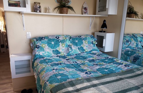 Whitney Beach House | Waterview bedroom, great location steps from Bridge Street