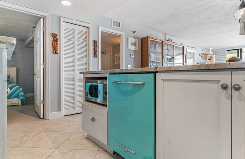 Bethune Beach Condo | Welcome to this stylish 2BR/2BA condo in Chadham By the Sea on a peaceful no-drive beach. Enjoy sweeping ocean views from the open living, dining, and kitchen area, all designed to showcase the scenery, with a calming beach-themed interior.