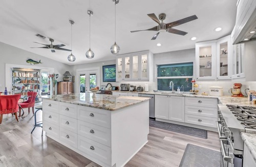 Truckland House | Your Hidden Florida Retreat | 4 King Suites, Luxury Kitchen, Heated Pool & Beach Adventures