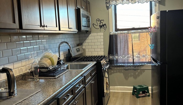 A charming comfy apartment with bright lights and lots of sunlight.