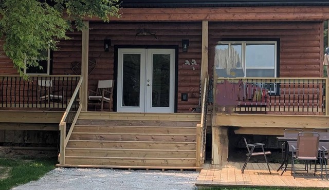 Cozy 2-bedroom cabin in quaint Walkerville with heat and AC for any season.
