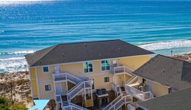 Directly on the beach! 2 beach chairs and 1 umbrella provided!