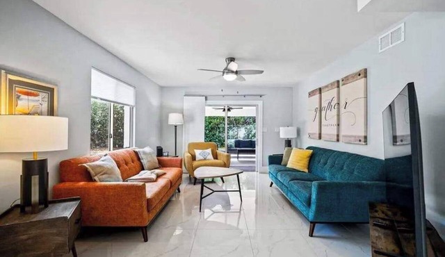 Dog-friendly colorful condo with shaded patio, washer/dryer, & central AC