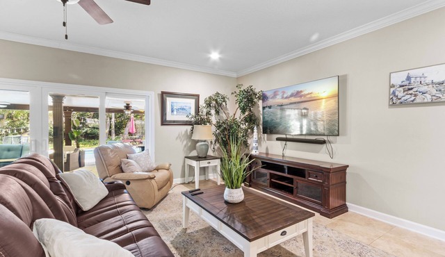 Escape to your Fort Walton Beach oasis! High-end 4BR home sleeps 8 with a resort backyard: heated pool with jets, 5-star outdoor kitchen, pizza oven, theater TV, and fire pit. Near top beaches, featuring chic coastal decor and keyless check-in.