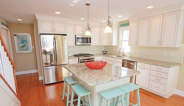 GORGEOUS, UPSCALE! Stainless steel appliances & Upgrades throughout! 2 parking spots off street and a fenced in rear yard