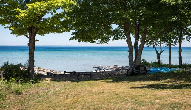 Immaculate 9 BR Beachfront Home on Grand Traverse Bay Sleeps 20