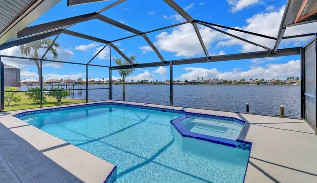 Luxury Gulf-Access Lakefront Retreat | Heated Pool, Spa, Bikes, Kayaks & Dock