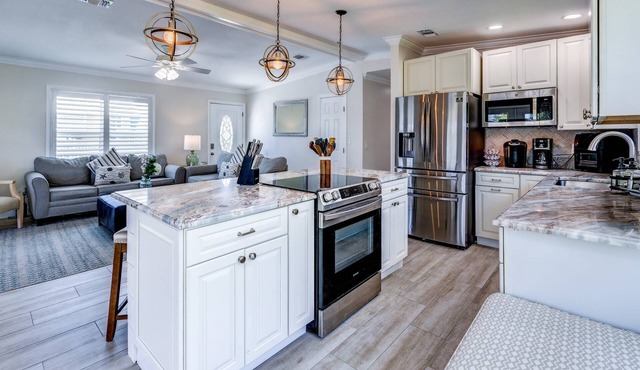 Mermaid Hideaway: Charming 2BR Canal Front Home with Pool, Tiki, Dockage, and Dog-Friendly Amenities