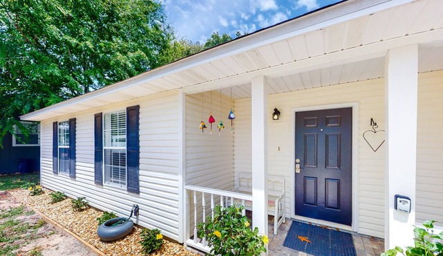Modern dog-friendly home near the Gulf with yard, grill, screened porch & bikes
