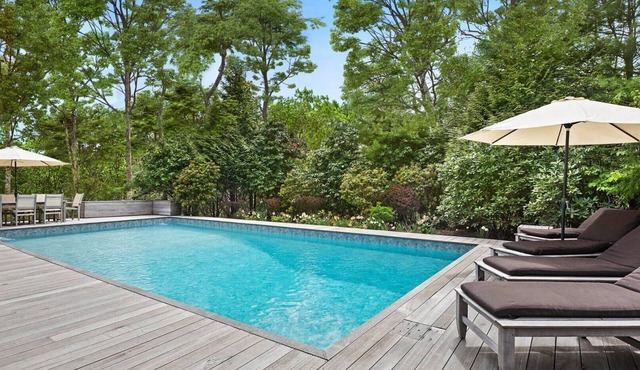 Modern East Hampton home with private heated pool, outdoor dining, perfect.