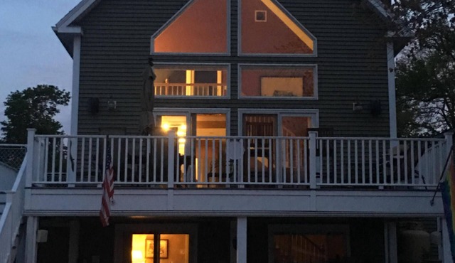 Modern home on Webster Lake with water access & spectacular views in Webster