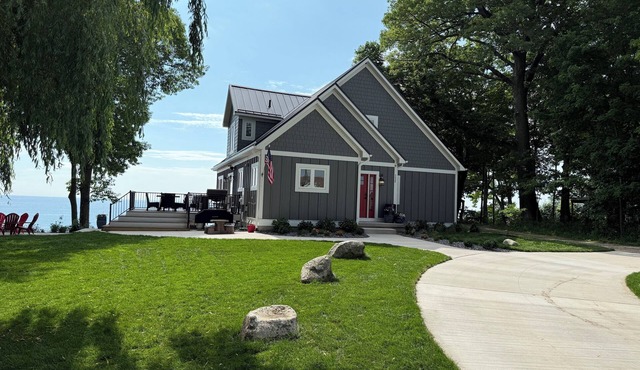 NEW & IMPROVED Spectacular beach front home on Lake Michigan