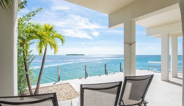 Open-water home with stunning views, 42' seawall for 40' boat, modern updates, large balcony