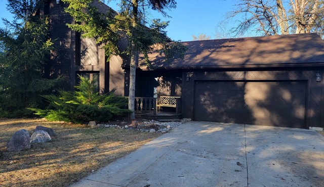 Secluded chalet in the woods overlooking a huge pond and only 5 minutes to town.