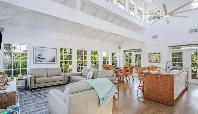 Stunning canal-front home with pools, AC, W/D & hammock