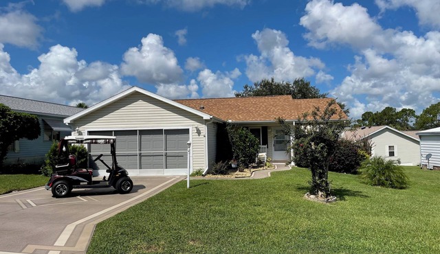 Sunlit retreat overlooking championship fairways—your Florida oasis awaits!