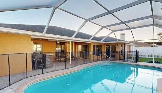 The Perfect Gateway Home with a large pool area, Gazebo, all fenced in.