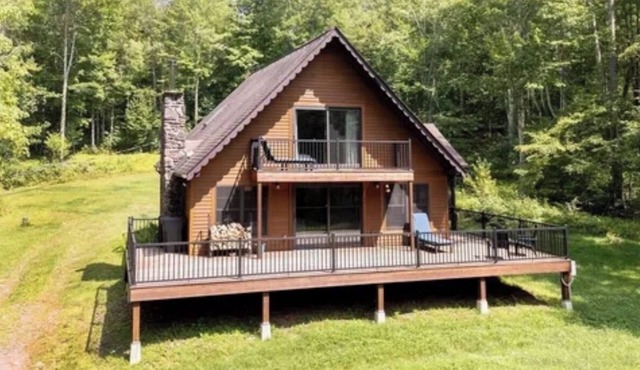 Tranquil cedar cabin on 13 private acres with hot tub and outdoor shower.