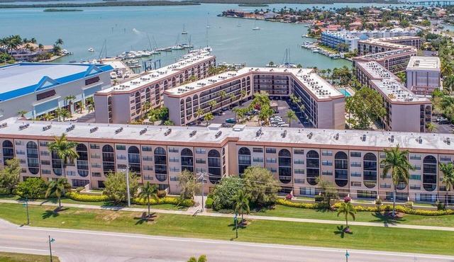 Waterfront 1BR condo in Marco Island with pool, WiFi & marina access.