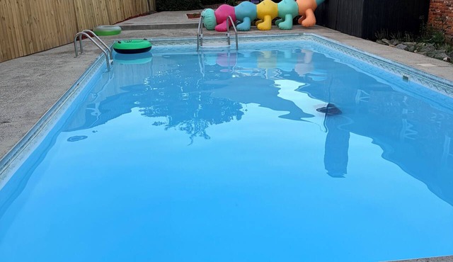 Welcome to Woosah. King size bed with a pool.
