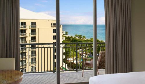 Room with Two Queen Beds, Balcony and Partial Ocean View